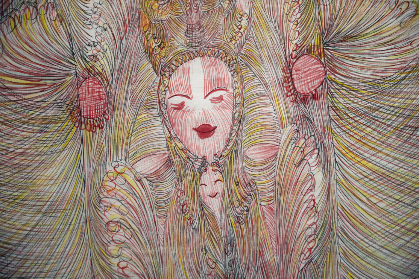 a smiling figure in pink, yellow, and green lines.