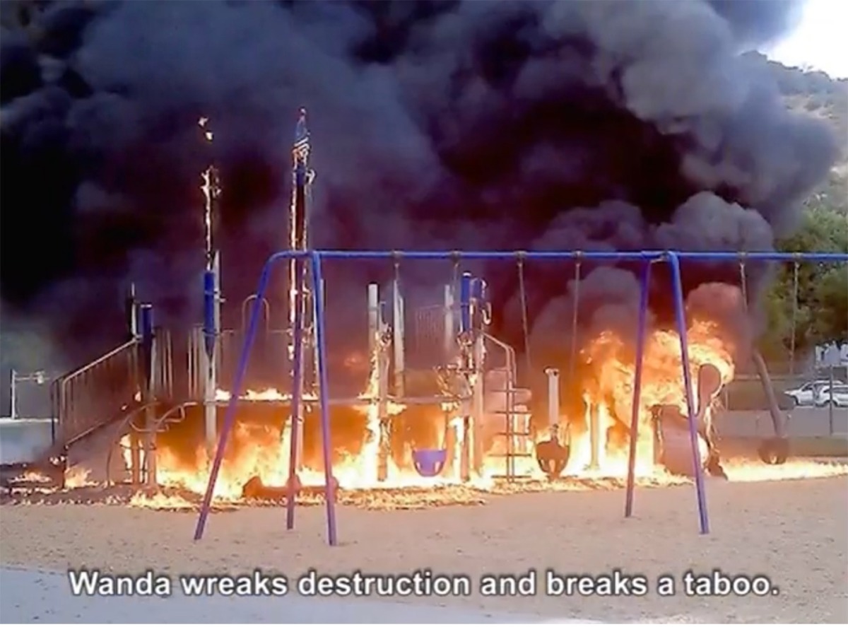 a screenshot of a burning playground with the captioned text Wanda wreaks destruction and breaks a taboo. 