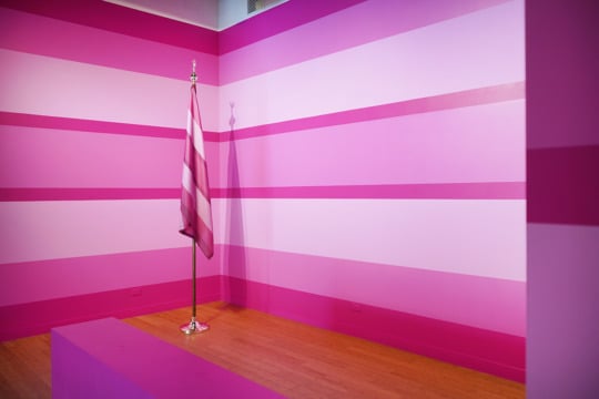 pink striped walls with pink white flag on wooden floor