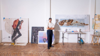 image of artist standing in the middle of their studio