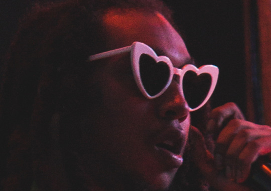 image of black man wearing heart-shaped glasses