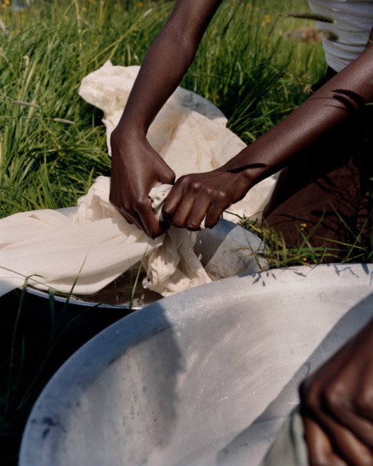 image of hands dying fabric outside