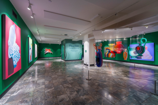 installation view of exhibition with green walls