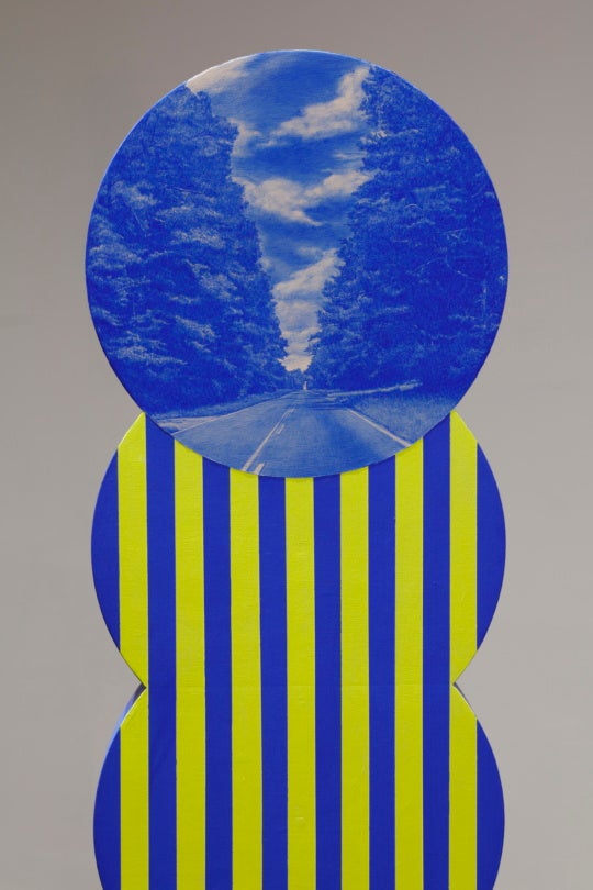 installation view of blue and yellow artwork