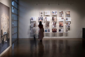 installation view of exhibition with people